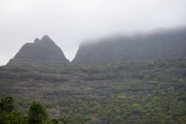 Kalavantin Durg pinnacle at left and flat plateau of Prabalgad at the right